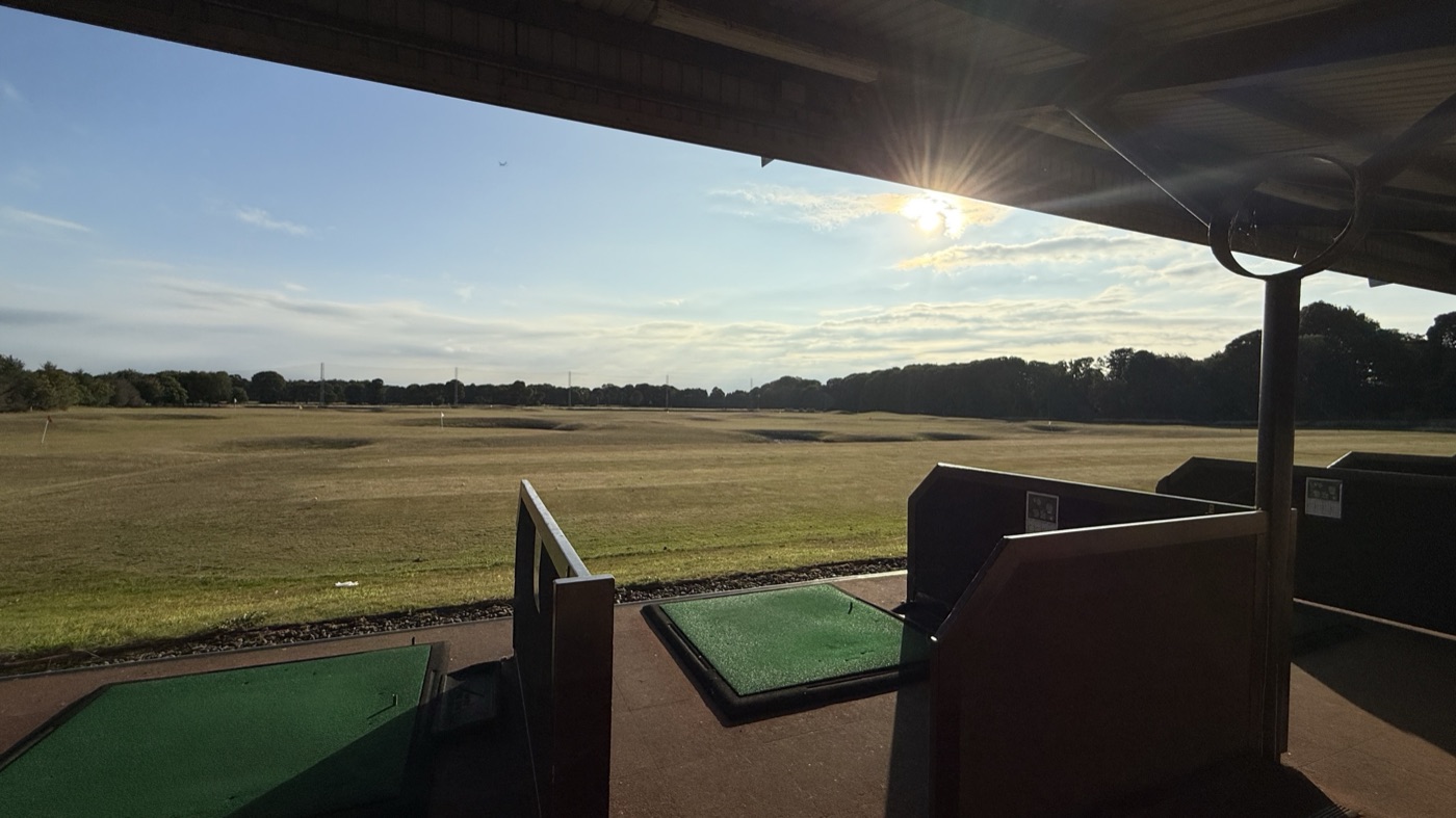 View out over the range from a Kings Acre practice bay at sunset